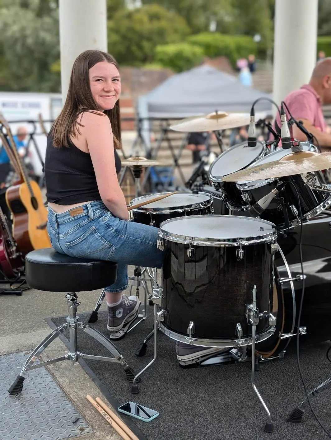 Girl playing drums.